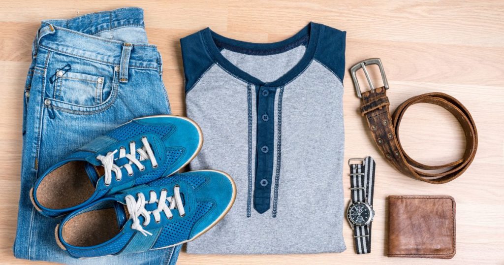 A close-up photograph showcasing accessories like a statement belt, a colorful scarf, and a stylish hat paired with vintage denim, adding the finishing touches to the overall look.