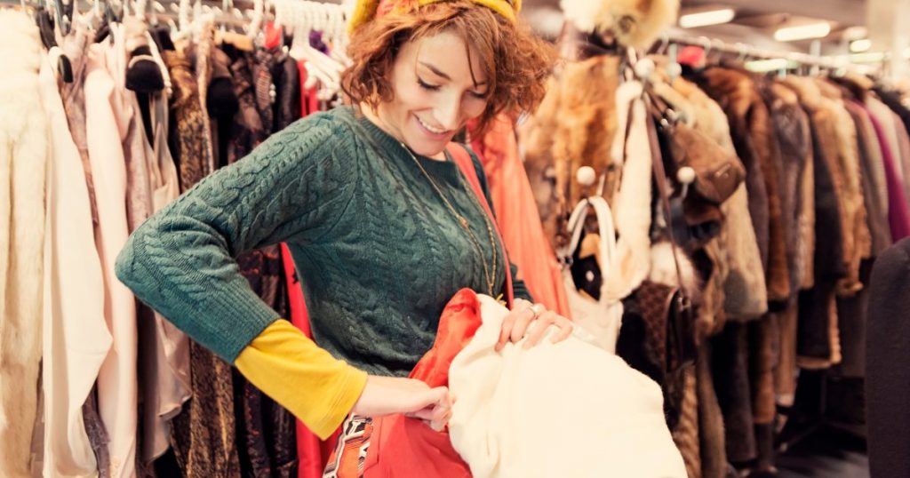 A colorful and vibrant snapshot of a thrift store rack filled with unique vintage garments, highlighting the thrill of exploring and discovering hidden gems.